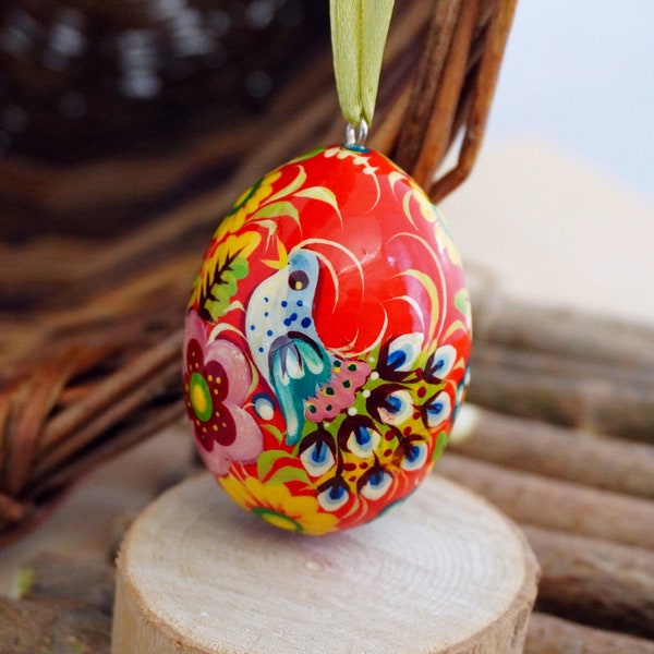 Ukrainian painted Easter wooden eggs traditional Pysanky with bird and flowers patterns, unique handmade Easter decorations