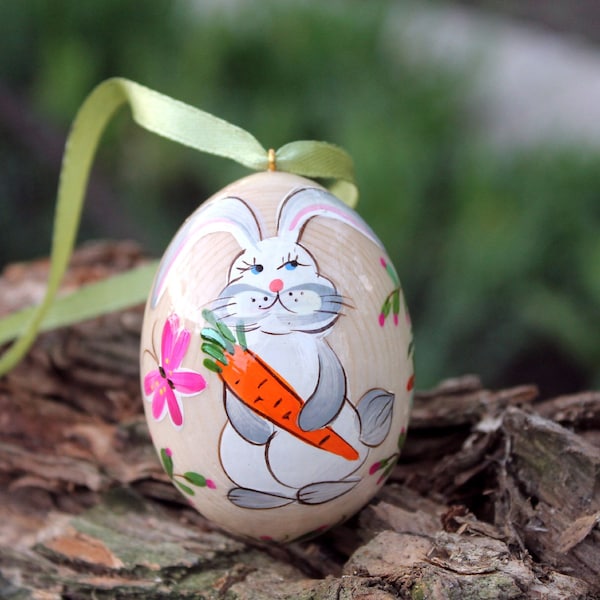 Wooden Easter egg decorations painted Easter rabbit with carrots, traditional handmade Easter Pysanky eggs with Petrykivka painting