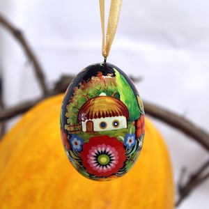 Easter egg painted ukrainian hut, traditional handmade Easter eggs with Petrykivka painting, Ukrainian Pysanky