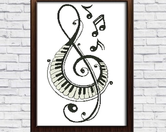 May include: Black and white cross stitch pattern of a treble clef with musical notes and a piano keyboard design. The pattern is framed in a brown frame.