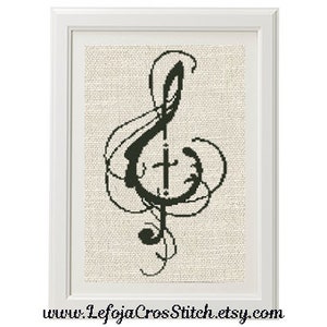 May include: Black and white cross stitch pattern of a treble clef with swirling lines around it.