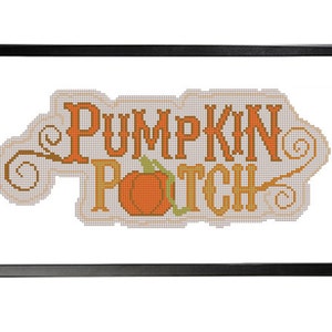 May include: A cross-stitch design with the words "Pumpkin Patch" in a yellow font. A small orange pumpkin is in the center of the design.