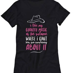 May include: Black t-shirt with a white cowboy hat graphic and the text "i like my COUNTRY MUSIC at the volume WHERE I CAN'T hear you complaining ABOUT IT" in pink.