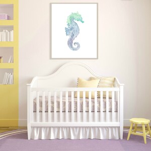 May include: A white crib with a white ruffle skirt and a purple and white patterned sheet. A yellow stool is in the corner of the room. A watercolor painting of a blue and green seahorse is hanging on the wall above the crib.