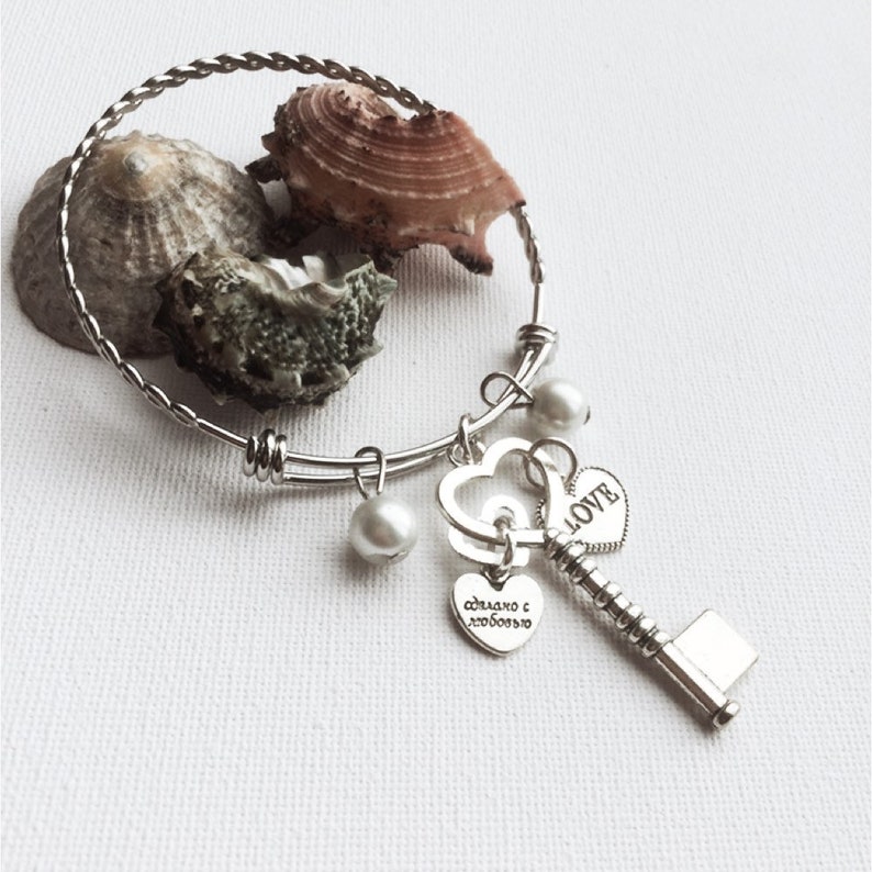 Key charm and double love heart silver bangle bracelet with pearls and adjustable with a twisted bangle design gift for her