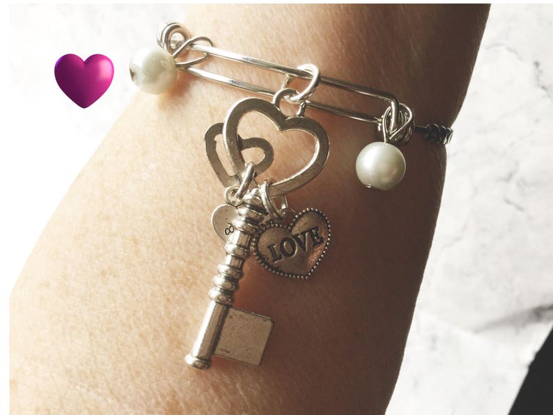 Key charm and double love heart silver bangle bracelet with pearls and adjustable with a twisted bangle design gift for her