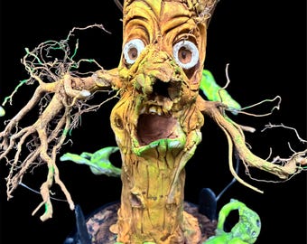 Battery operated spooky tree light with flying ghosties
