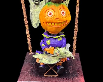 Calabaza de papel maché con forma de fantasma planchador