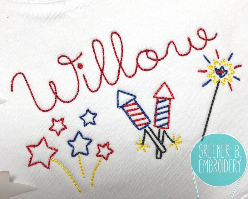 May include: Embroidered design featuring the name "Willow" in red thread, with fireworks and stars in red, white, and blue. The design is on a white fabric background.