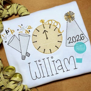 May include: White long-sleeved shirt with embroidered New Year's Eve theme. Features a gold clock, party horns, confetti, and a party hat with the year 2026. The name "William" is embroidered in black. A gold ribbon is in the background.