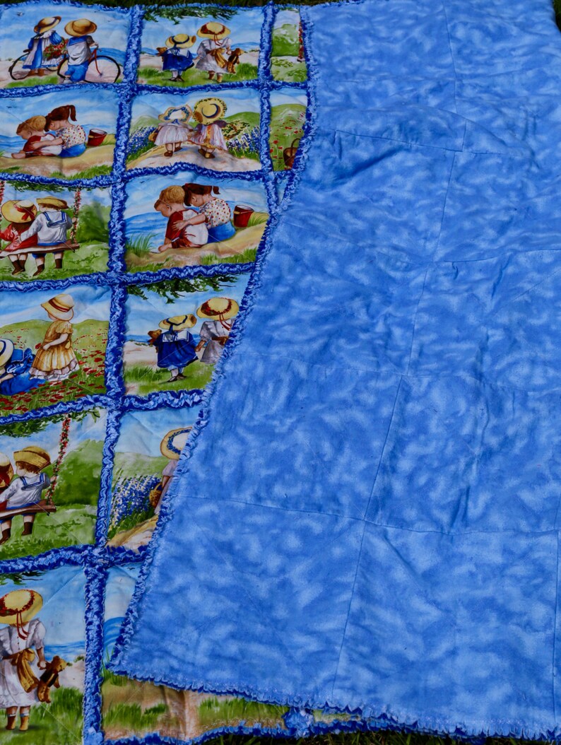 Blue rag quilt 55x55 lap size quilt Children near the ocean playing