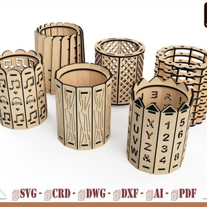 May include: Six cylindrical wooden pen holders with laser-cut designs. One features musical notes, one has vertical slats, one a lattice pattern, one a scalloped edge, one wood grain textures, and one displays letters and numbers from 1 to 8.
