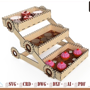 May include: A three-tiered wooden stand with decorative cutouts. The stand is designed to hold small items like candies, cookies, or cupcakes. The top tier has red apples, the middle tier has chocolate cookies, and the bottom tier has pink cupcakes.