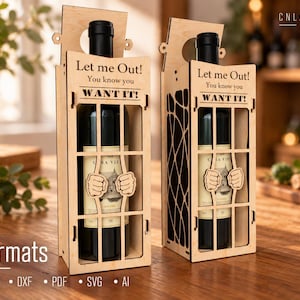 May include: Two light-coloured wooden wine bottle holders designed like jail cells. Each features a cutout of hands gripping bars and the engraved text Let me Out! You know you WANT IT! The structures are tall, rectangular, and open-faced.