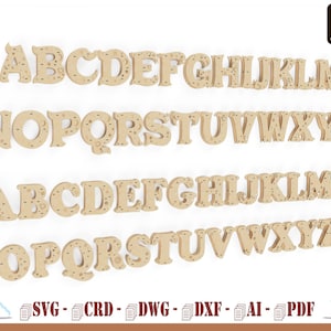 Puede incluir: Un conjunto de letras mayúsculas de la A a la Z en una fuente decorativa con un patrón de estrellas y lunas. Las letras están cortadas en madera y están listas para ser utilizadas en proyectos de manualidades.