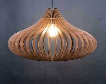 May include: A pendant light fitting constructed from curved, light brown wooden slats arranged in a symmetrical, rounded, onion-like shape. The structure features an open design that reveals a single glowing light bulb suspended in the centre.