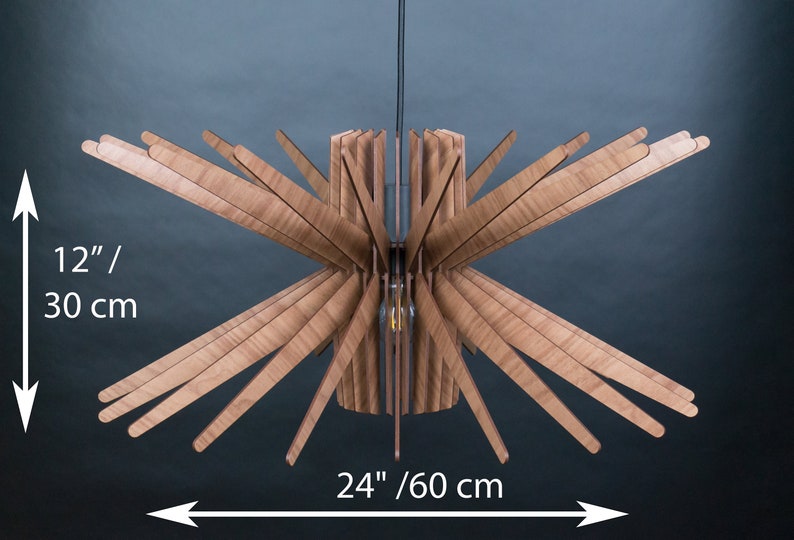 May include: A wooden ceiling light fixture with a starburst design. The light is 24 inches wide and 12 inches tall.
