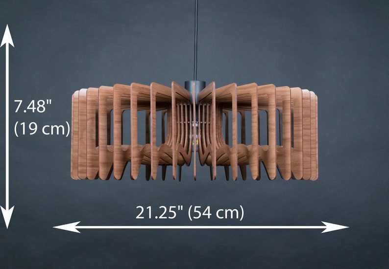 May include: A wooden pendant light fixture with a geometric design. The light is 7.48 inches tall and 21.25 inches wide.