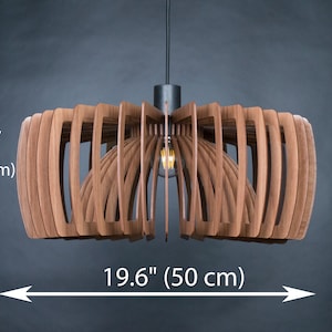 May include: A wooden pendant light fixture with a geometric design. The light is 19.6 inches wide and 7.9 inches tall.