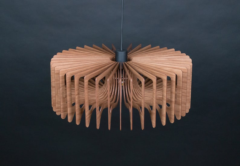 May include: A modern wooden ceiling light fixture with a circular design. The light is made of thin, overlapping wooden slats that create a unique and intricate pattern.