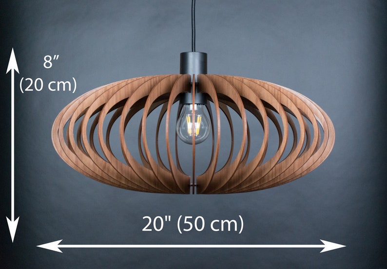 May include: A wooden pendant light fixture with a circular, open-weave design. The light fixture is 20 inches wide and 8 inches tall.