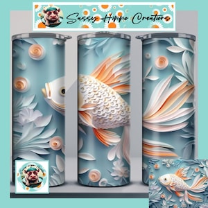 May include: A set of three stainless steel tumblers with a light blue background and a koi fish design. The fish has white scales and orange fins. The tumblers also feature white flowers and the text "Sassy Hippo Creations".