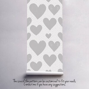 May include: A seamless pattern featuring gray hearts on a white background with small pink dots. The size of the pattern can be customized to fit your needs. Contact me if you have any suggestions.