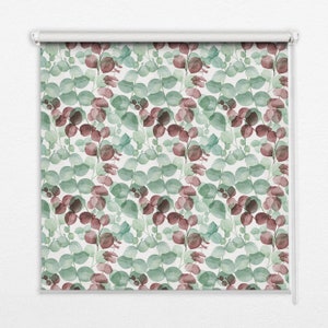 May include: A white roller blind with a repeating pattern of watercolour eucalyptus leaves in shades of green and burgundy.