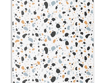 May include: A seamless pattern featuring a terrazzo design with black, white, light blue, and orange speckled chips on a white background.