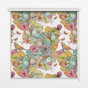 May include: A colorful, patterned roller blind with a white background featuring a repeating design of birds, flowers, and leaves. The design is intricate and detailed, with a variety of colors and shapes.