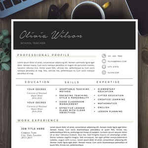 May include: A black and white resume template with the name Olivia Wilson, School Teacher, at the top. The resume includes sections for Professional Profile, Education, Skills, Expertise, and Work Experience. The resume is on a wooden surface.