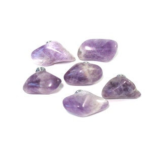 May include: Six amethyst crystal cabinet knobs with silver metal hardware. The knobs are various shapes and sizes.