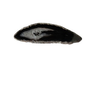 May include: A polished, oval-shaped agate slice with a black exterior and a white and gray interior. The edges are rough and textured. This decorative stone is ideal for home decor or jewelry making.