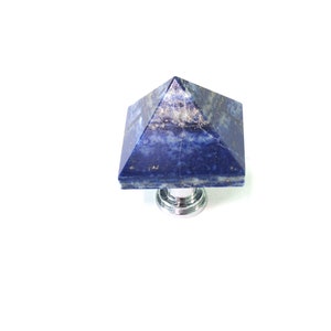 May include: A blue lapis lazuli pyramid-shaped cabinet knob with a silver base.