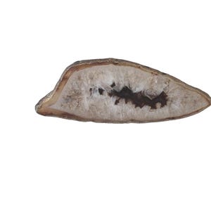 May include: A polished, oval-shaped agate geode slice. The outer edge is a light brown, framing a white and translucent interior with a dark brown, crystalline center. The geode is set against a plain white background.