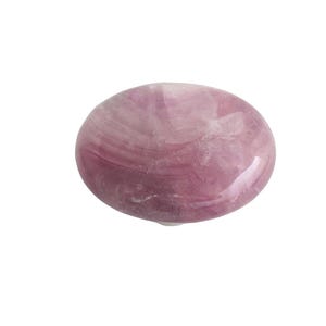 May include: A smooth, oval-shaped, polished stone in shades of pink and lavender. The stone has a translucent quality with visible swirling patterns. The overall appearance is glossy and natural, suggesting a gemstone or decorative item.