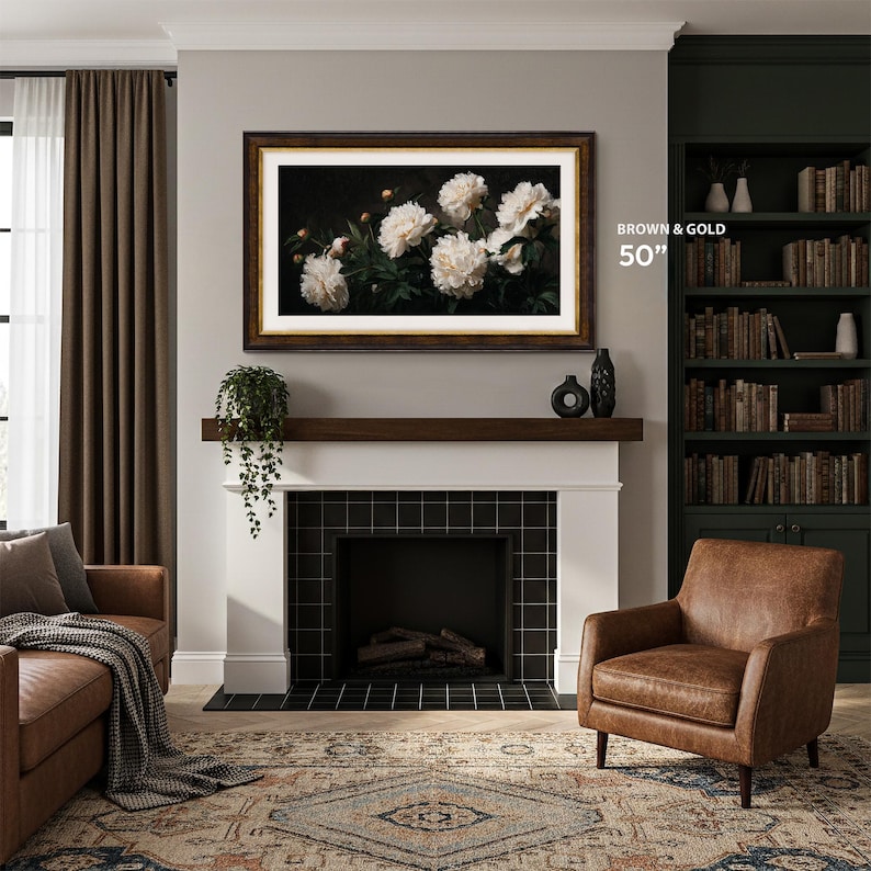 French countryhouse living room with brown leather armchair, black brick fireplace with white brick frame, dark brown wooden mantel, brown and gold tv frame 50 inch, green contemporary bookshelf