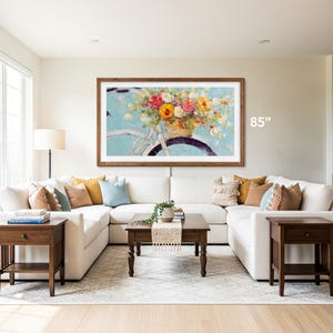 natural wood tv frame 85 inch Samsung tv bezel on a white wall, boho living room interior with huge u shaped corner sofa, early american furniture matching the tv frame with summer tv art hisense canvas frame