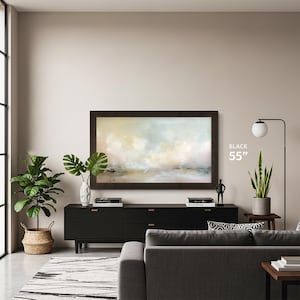 black tv frame for samsung the frame 55 inch tcl nxtvision bezel on a beige wall with black tv console below modern living room interior abstract carpet and gray sofa