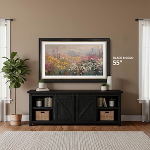 samsung frame tv black and gold 55 inch tv on the wall against a mocha brown wall with black farmhouse tv console, contemporary abstract wildflower field tv art