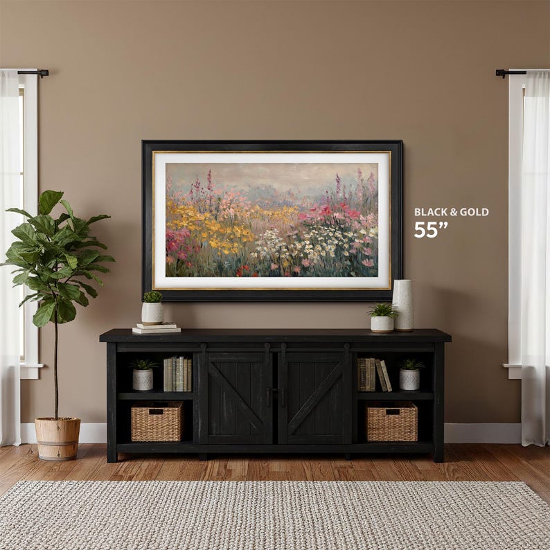 samsung frame tv black and gold 55 inch tv on the wall against a mocha brown wall with black farmhouse tv console, contemporary abstract wildflower field tv art