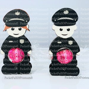 May include: Two black and white cardboard police officer favor boxes with a pink chocolate candy inside. The boxes are designed to hold a Lindor chocolate.