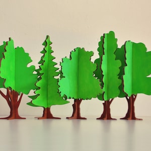 Ensemble de 10 arbres de Noël décoratifs en bois fabriqués à la main, motif vectoriel prêt pour CNC Modèle pour support d'ornement d'arbres de puzzle 3D découpé au laser image 3