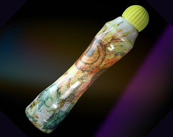 May include: A yellow and white marker with a sunflower design and glitter. The marker has a yellow cap.