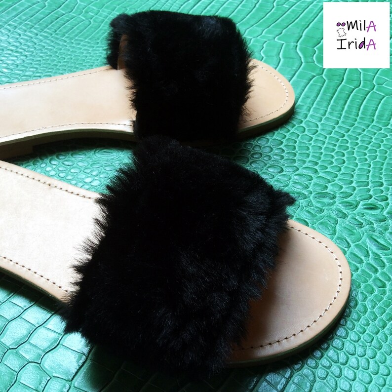 Cowhide and faux fur mules.