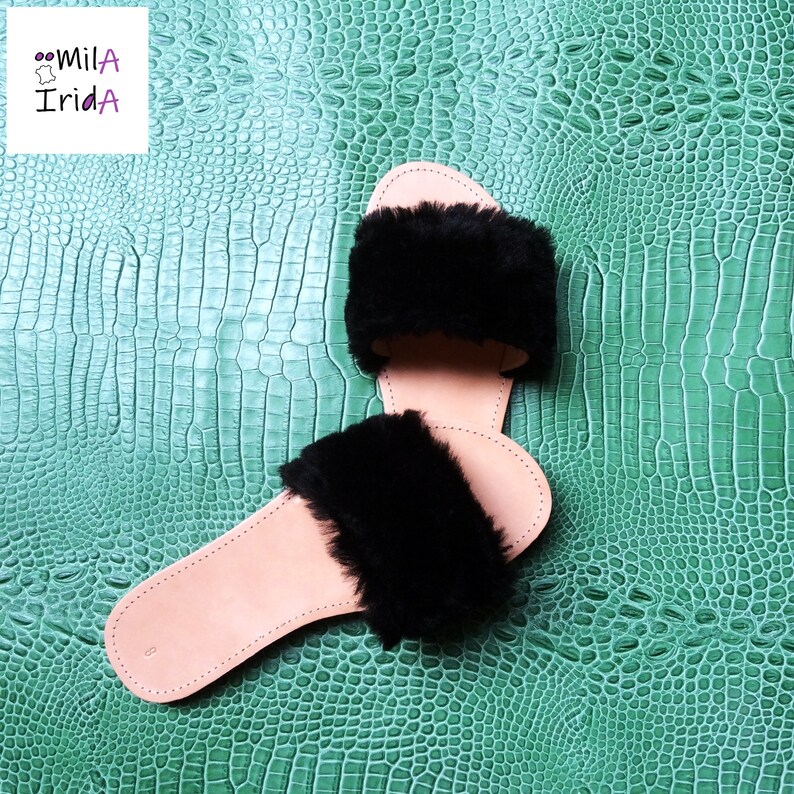 Cowhide and faux fur mules.
