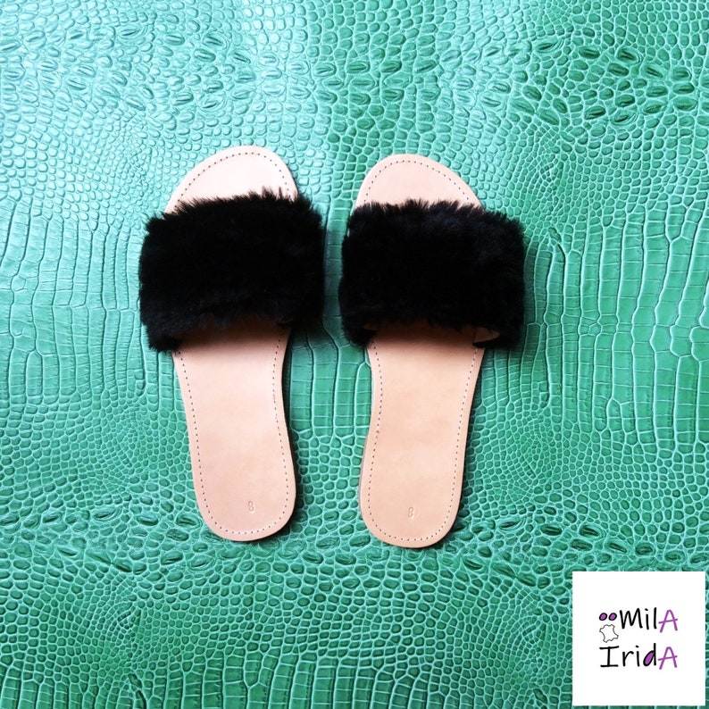 Cowhide and faux fur mules.