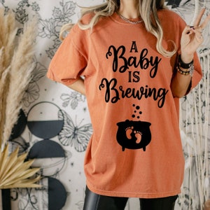 baby brewing halloween pregnancy unisex shirt, halloween maternity shirt, halloween pregnancy announcement shirt, halloween pregnant shirt