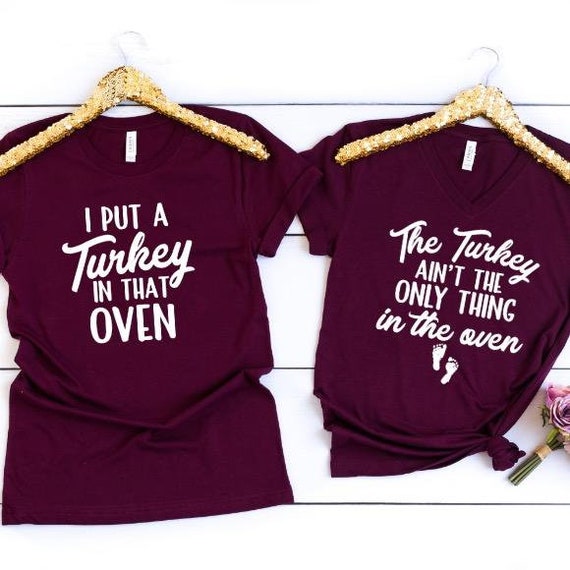 Womens The Turkey Aint The Only Thing In The Oven Baby Announcement T-Shirt Womens The Turkey Aint The Only Thing In The Oven Baby Announcement T-Shirt