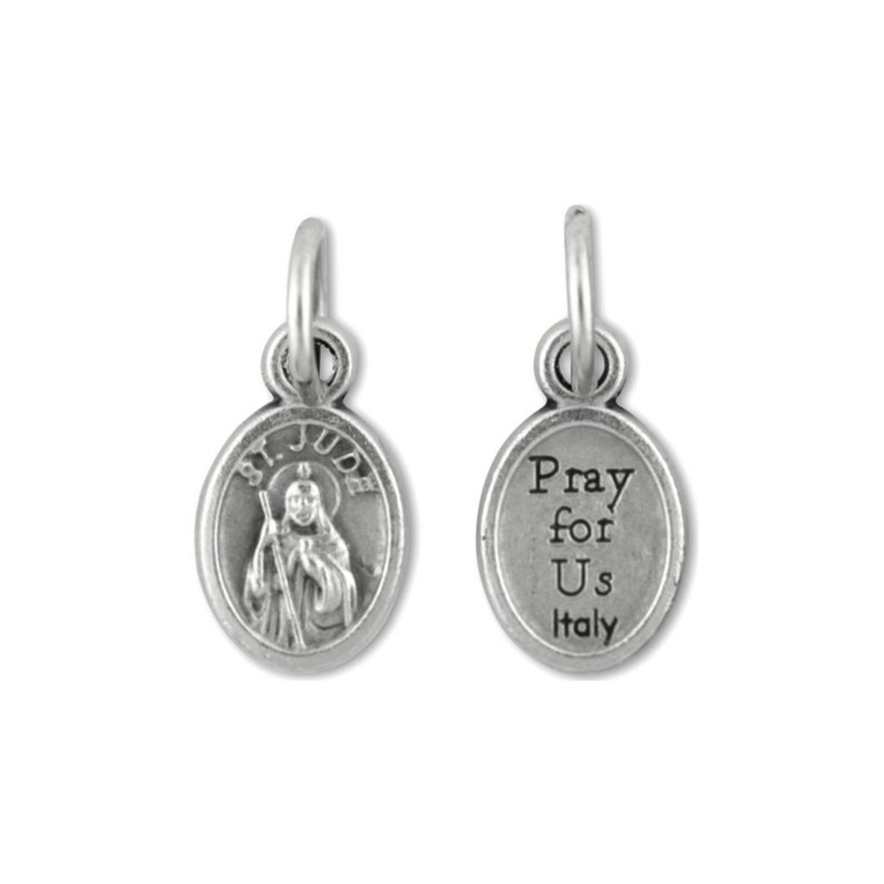 May include: Silver charm featuring an oval pendant with an image of Saint Jude Thaddeus on one side and the text "Pray for Us Italy" on the other side.